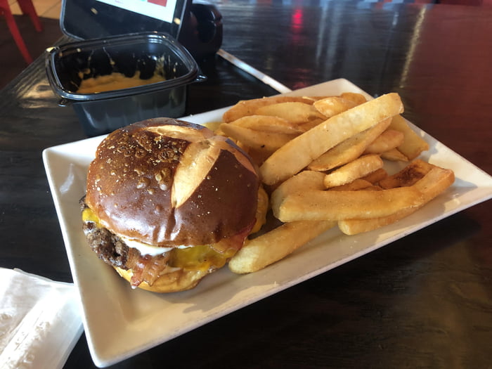 A Pretzel Bacon Beer Cheese Burger with Steak Fries