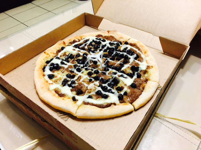 What's the most bizarre pizza you can find in the Pizzahut of your country? Here is Bubble Tea Pizza from Taiwan.