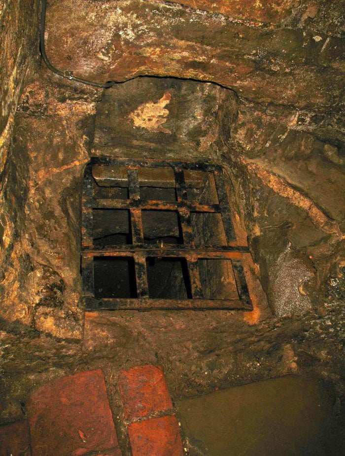 The lower dungeon of Warwick Castle. It's an 'oubliette', where prisoners were dropped and forgotten about.