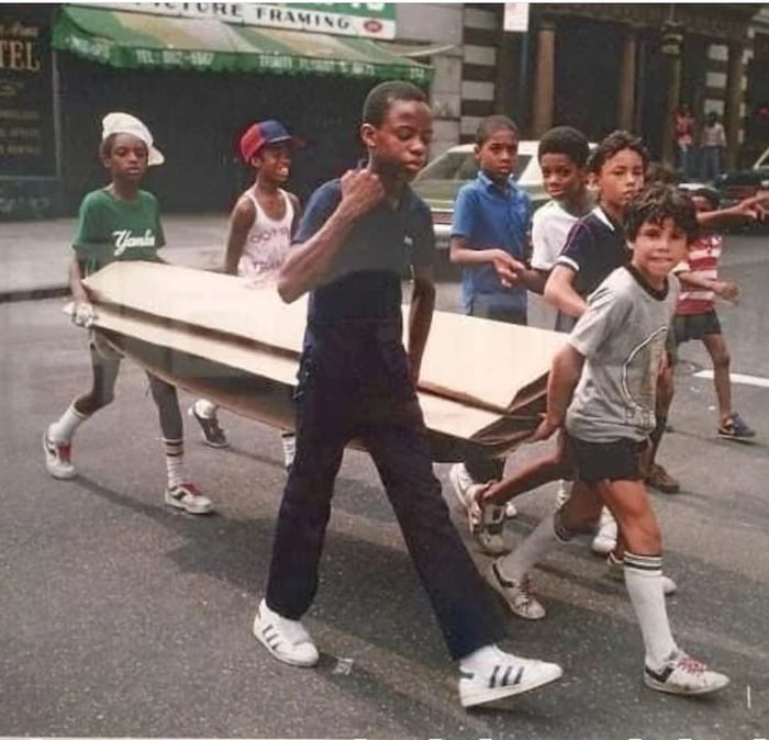 Kids carrying cardboard for break dancing (Martha Cooper - 1983)