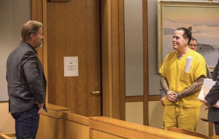 The Alaskan Avenger" Jason Vukovich smiling at his brother after receiving a 23 year sentence. Jason used the state's sex offender registry to track down offenders, break into their homes, and beat them with a hammer. Both Jason and his brother were