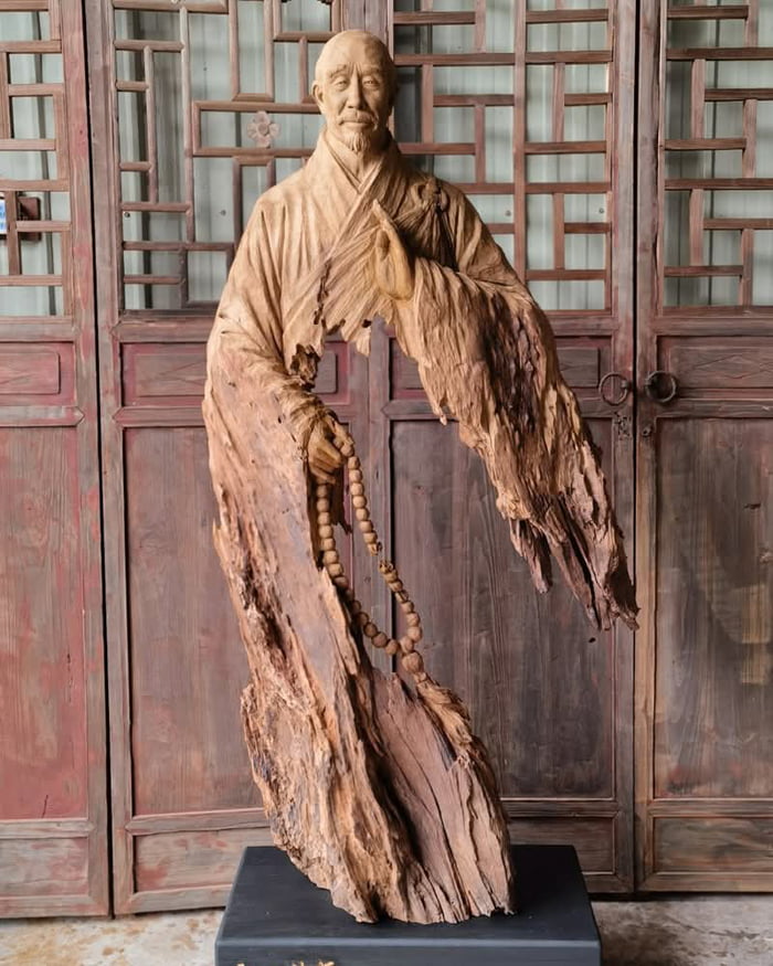Wooden sculpture of Master Hongyi. Made in 2022 by artist Tian Guoran