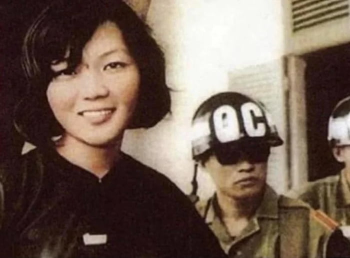 Võ Thi Thang smiling after being sentenced to 20 years hard labour in a prison camp by the South Vietnamese govt. After being sentenced she reportedly smiled at the judge and said "20 years? Your government won't last that long