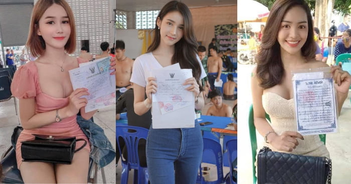 Thai Men Displaying Their Certificates Exempting Them from Military Service