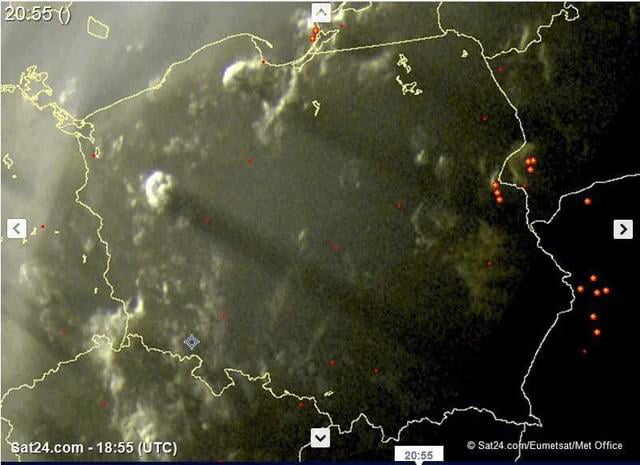 The two clouds captured over Poland are so tall they are casting shadows over the entire country