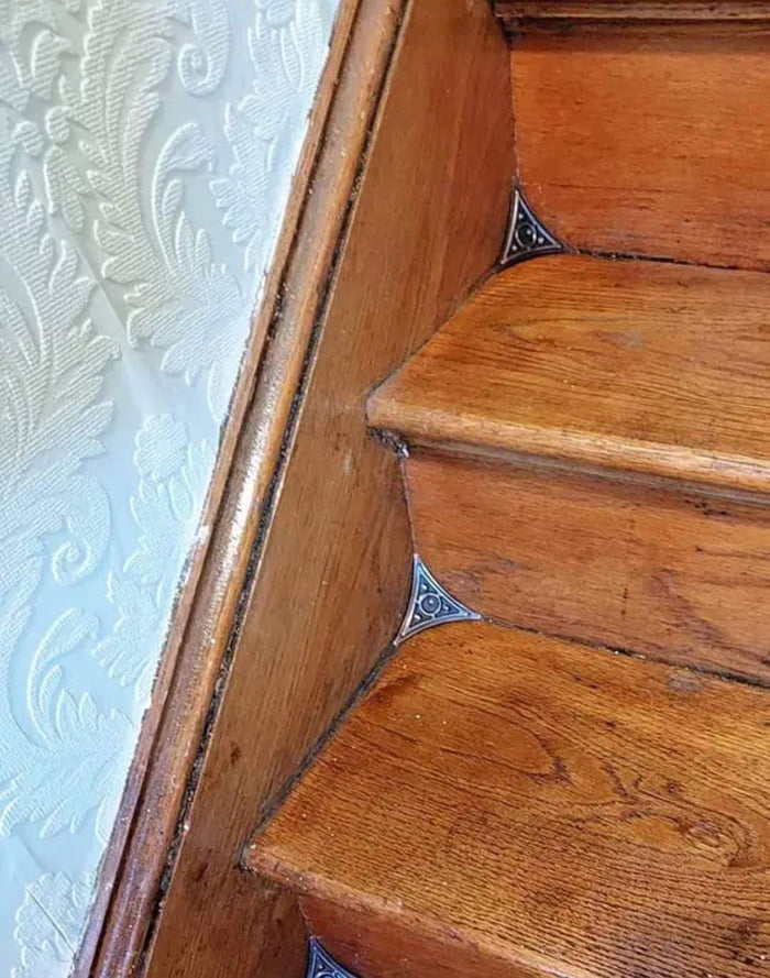 Stair dust corners introduced at the end of the 19th century to make sweeping easier. They keep dust from accumulating in the corners