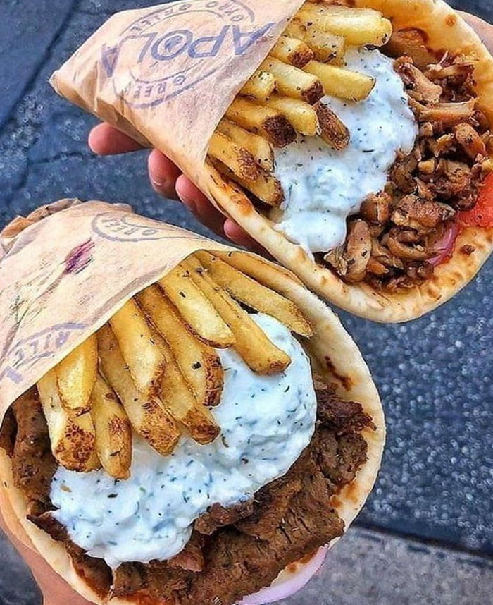 A couple of mouthwatering gyros with fries