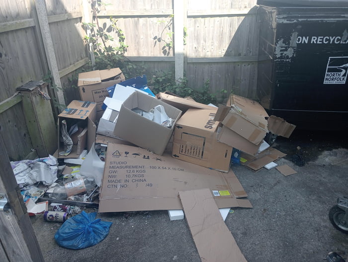 New neighbours moved in. This is how they left the communal rubbish area. Any passive aggressive revenge ideas are welcome.