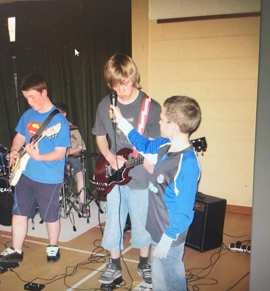 Turn back to me playing a gig in 2007, didn't have a microphone stand so had to ask my band mates brother to hold the mic for the whole set