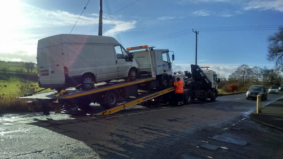 A recovery truck recovering a recovery truck on a recovery.