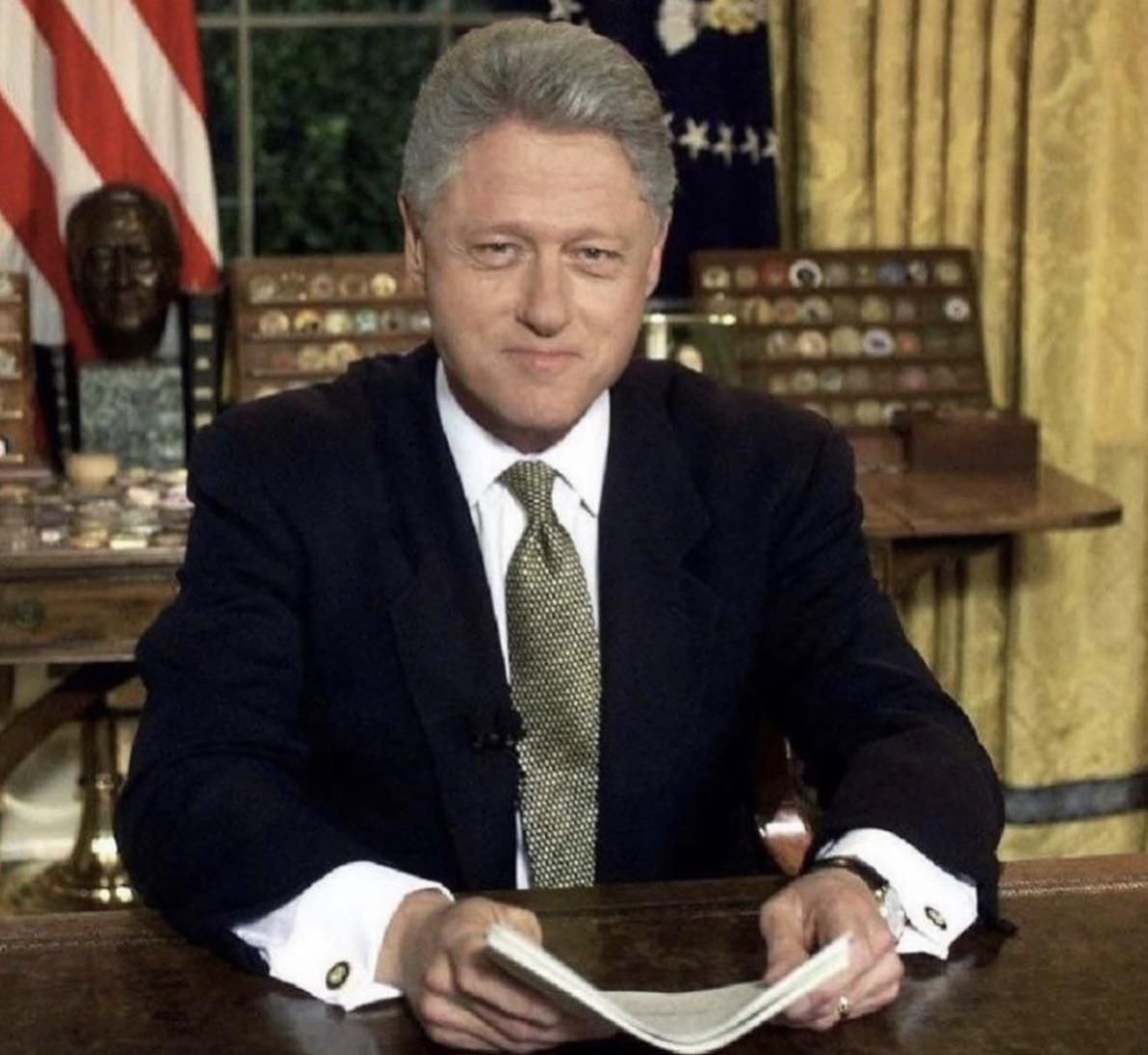 President Bill Clinton and Monica Lewinsky together at his desk in the Oval Office. 1995